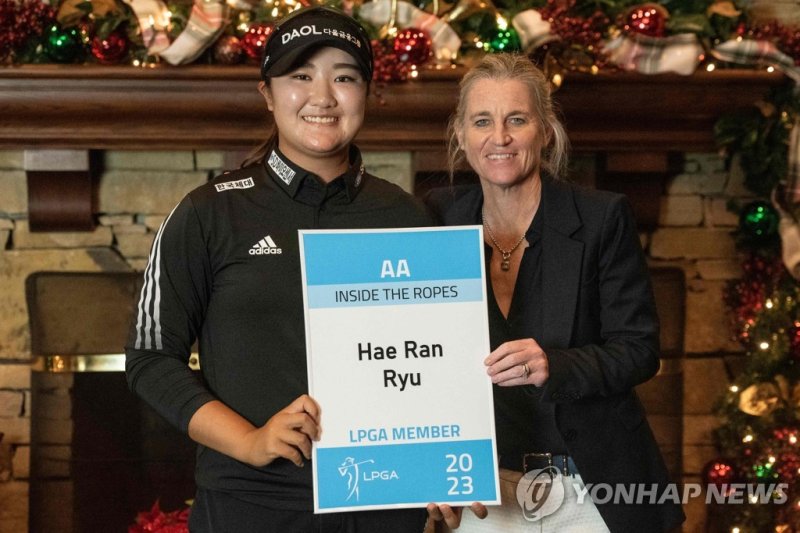 DOTHAN, AL - DECEMBER 11: Hae Ran Ryu of the Republic of Korea and LPGA Tour Commissioner Mollie Marcoux Samaan pose with her tour card after the final round of the 2022 LPGA Q-Series - Dothan at Highland Oaks Golf Course on December 11, 2022 in Dothan, Alabama. Hannah Ruhoff&#x2F;Getty Images&#x2F;AFP (Photo